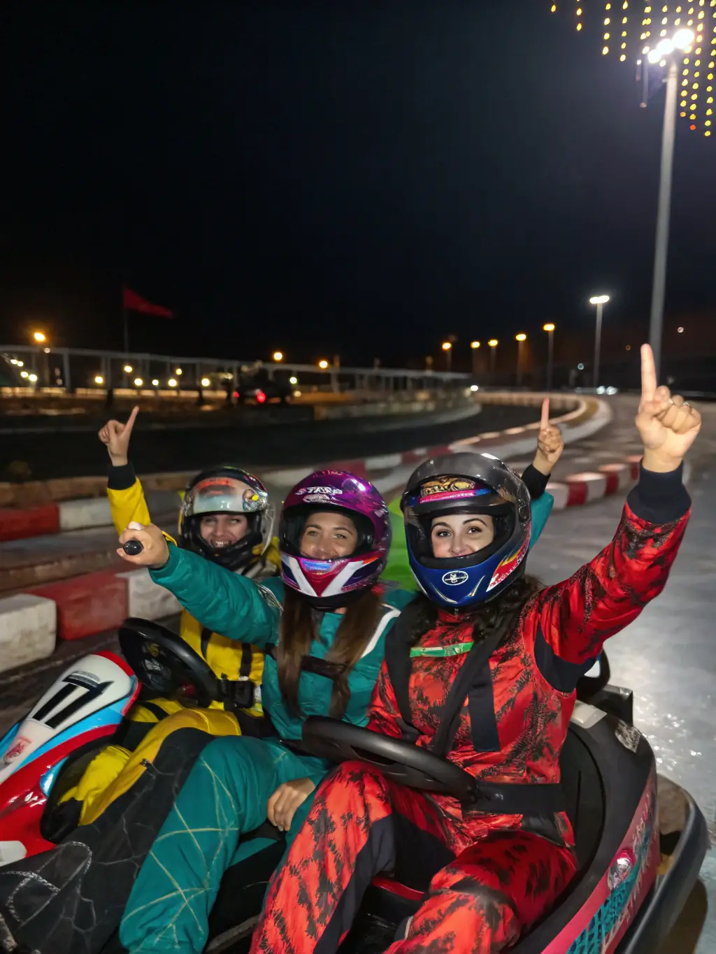 An inspiring photograph of AK DU CENTRE members participating in a national karting event, proudly representing the organization and demonstrating their competitive spirit.
